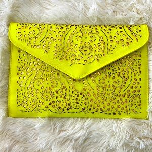 Neon yellow and gold envelope bag with brass strap